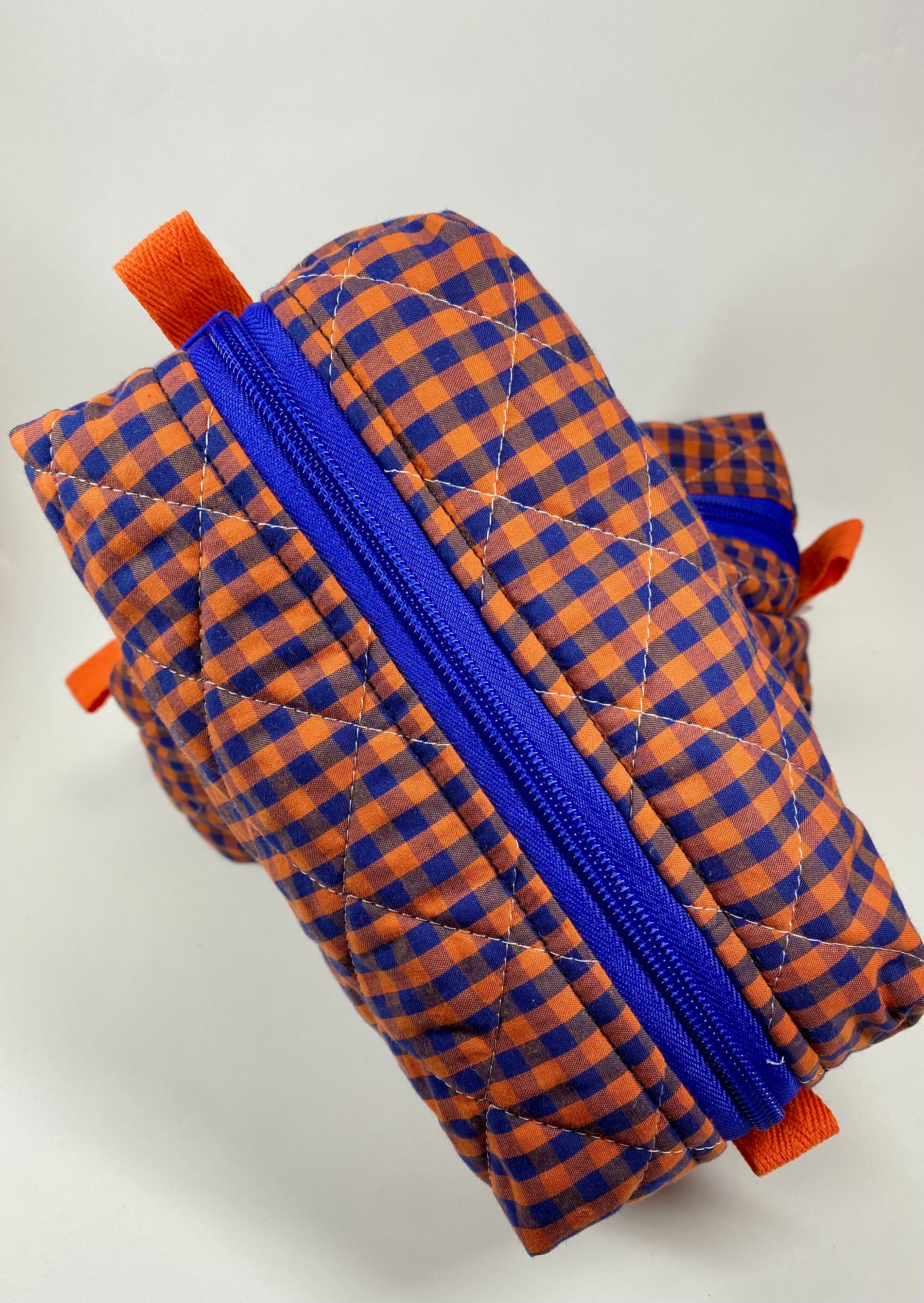 Neceser acolchado rectangular azul y naranja